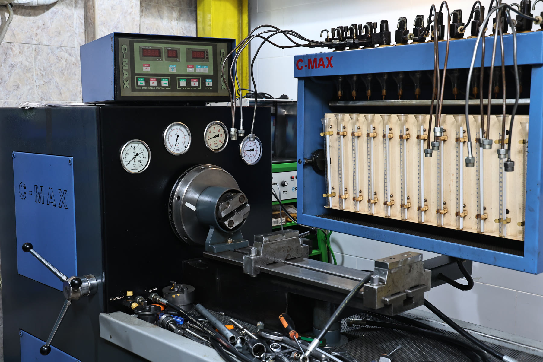 Diesel fuel injection pump under test in Abra Diesel's calibration room, Sharjah