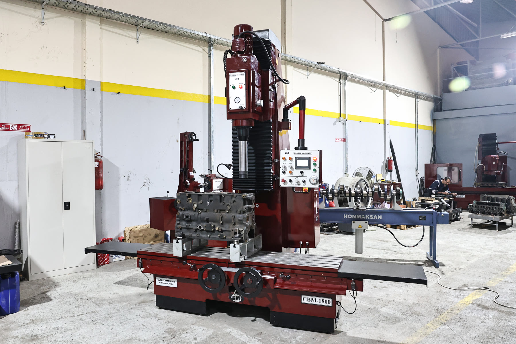 Line boring machine set up with a diesel engine block at Abra Diesel
