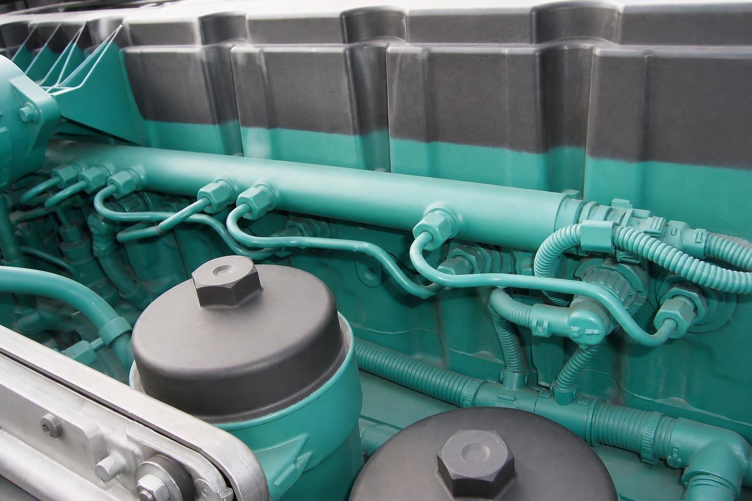 Close-up of the complete common-rail arrangement installed on a Volvo D7E 7.2 L truck engine.