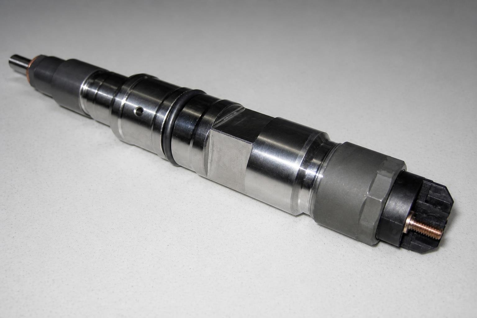 Large diesel injector with its nozzle end visible