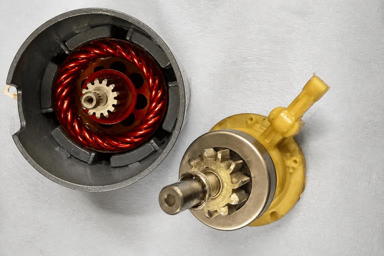 Clean rebuilt starter-motor armature, reduction gear and field components
